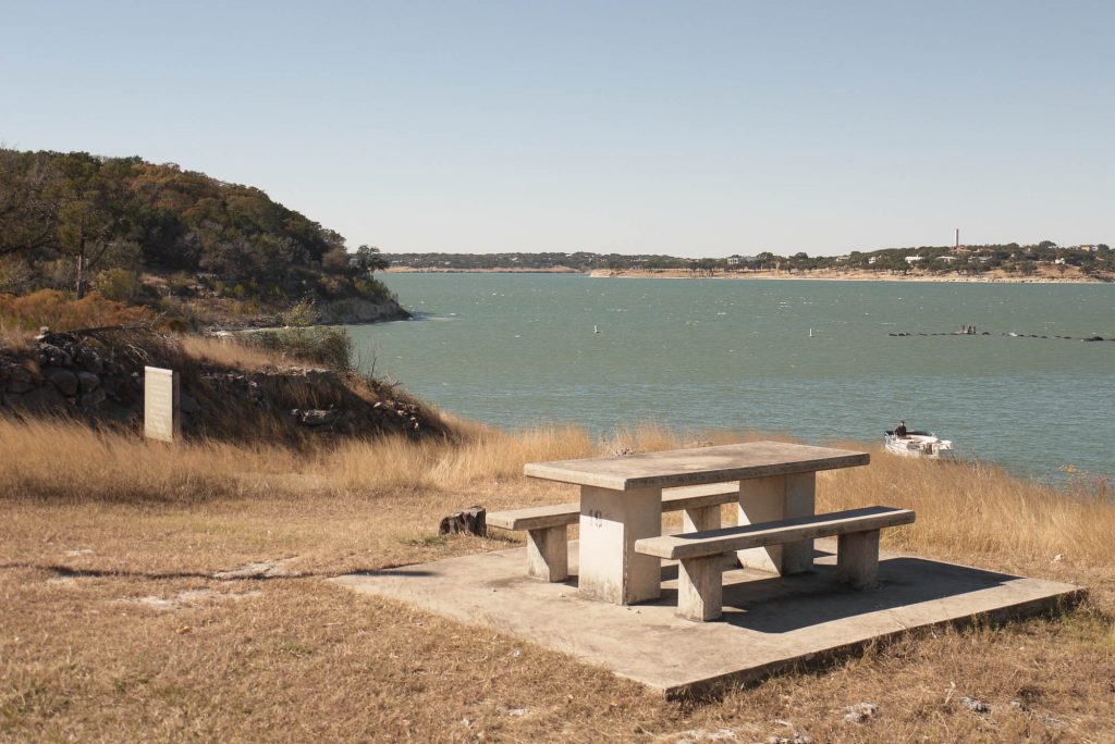 Picnic table on the shores of Canyon Lake near San Antonio, Texas
